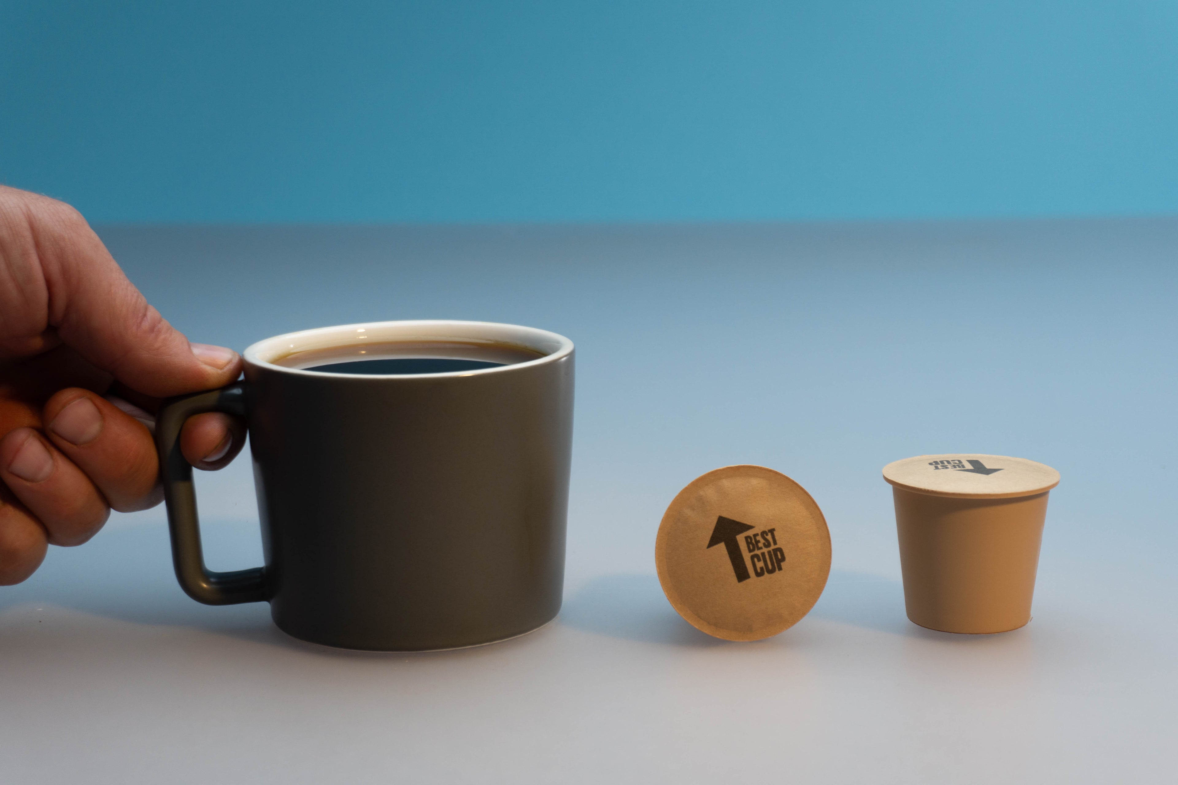 image of a coffee mug and two coffee pods