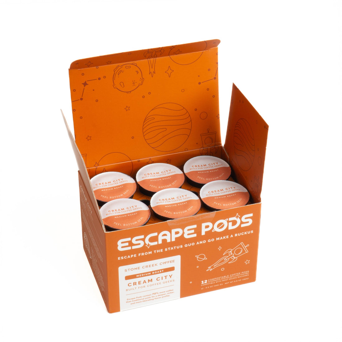 Box of 'Escape Pods' branded coffee pods on a white background. 