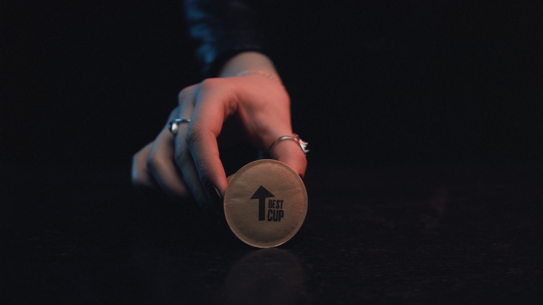 image of coffee pod in a woman's hand